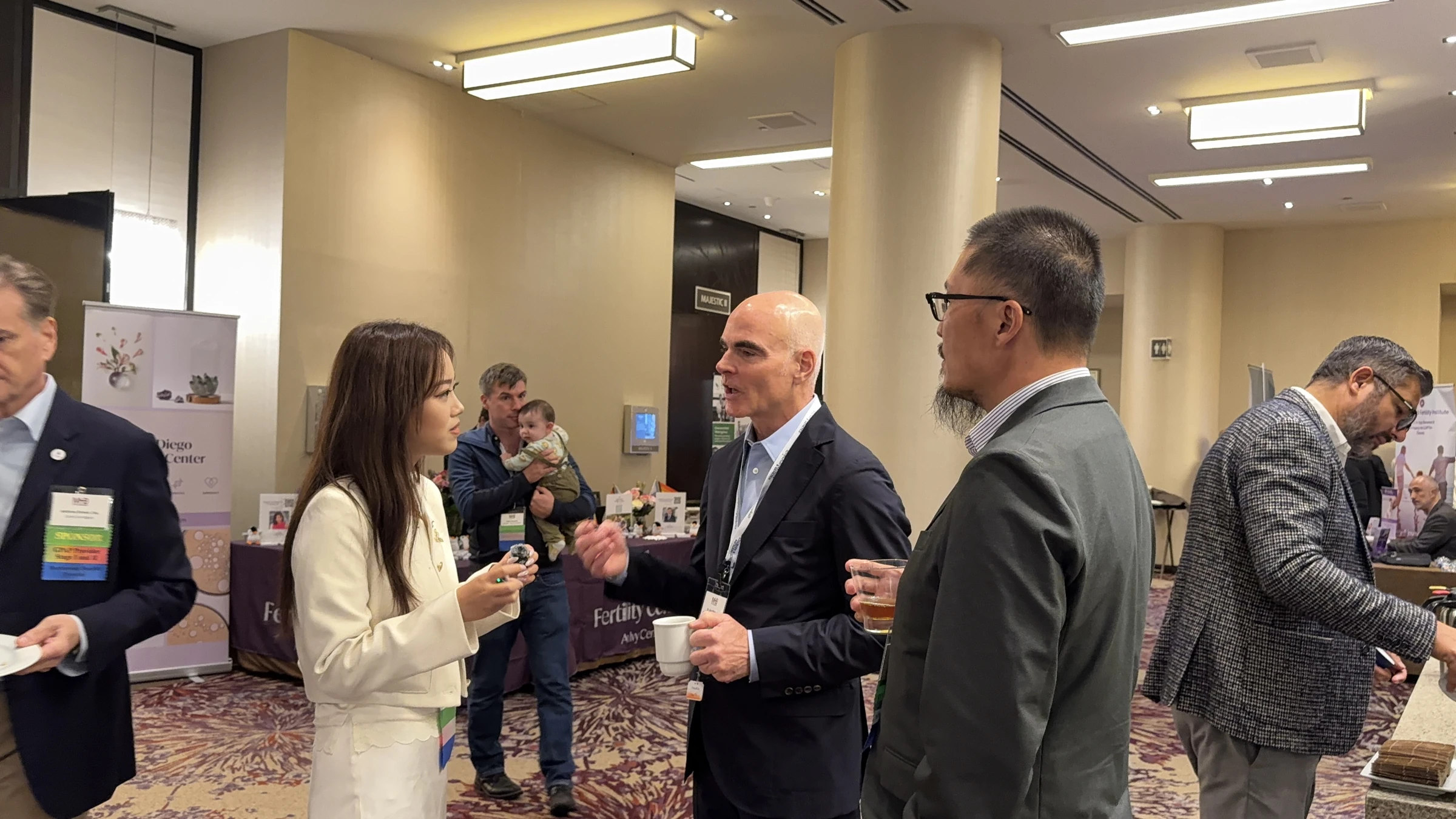 Yunda Surrogacy team speaking with an attendee · MHB New York 2026